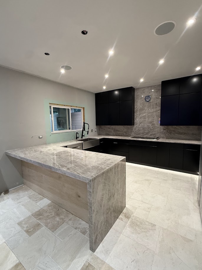 Modern kitchen with quartz countertops and waterfall island in Jacksonville, FL