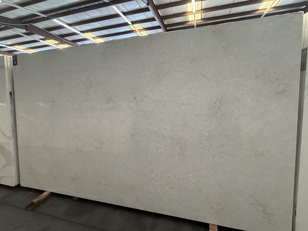 Warm beige quartz slab with soft natural movement