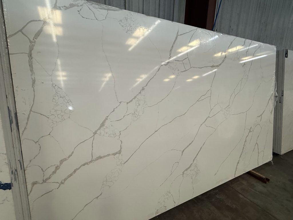 Light quartz countertop slab with minimal movement

Warm and Beige Quartz