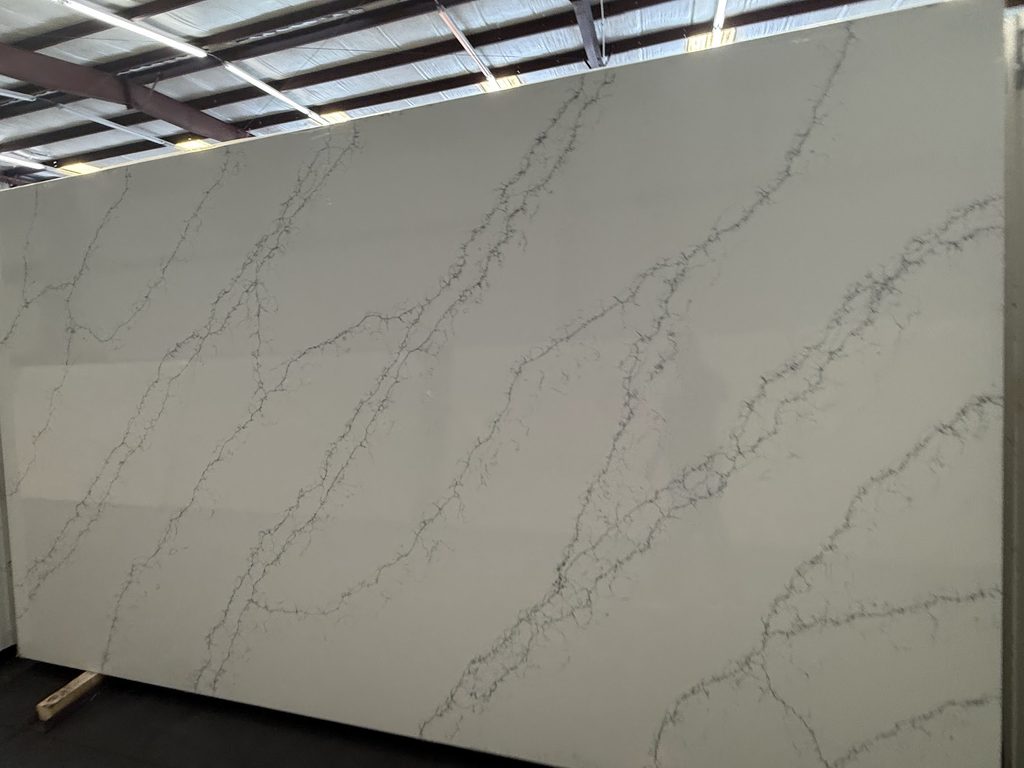 Light quartz countertop slab with minimal movement

Warm and Beige Quartz