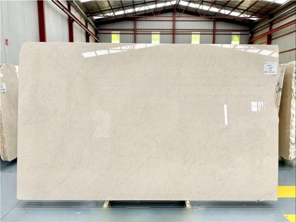 Crema Marfil marble slab with warm beige tones and subtle veining